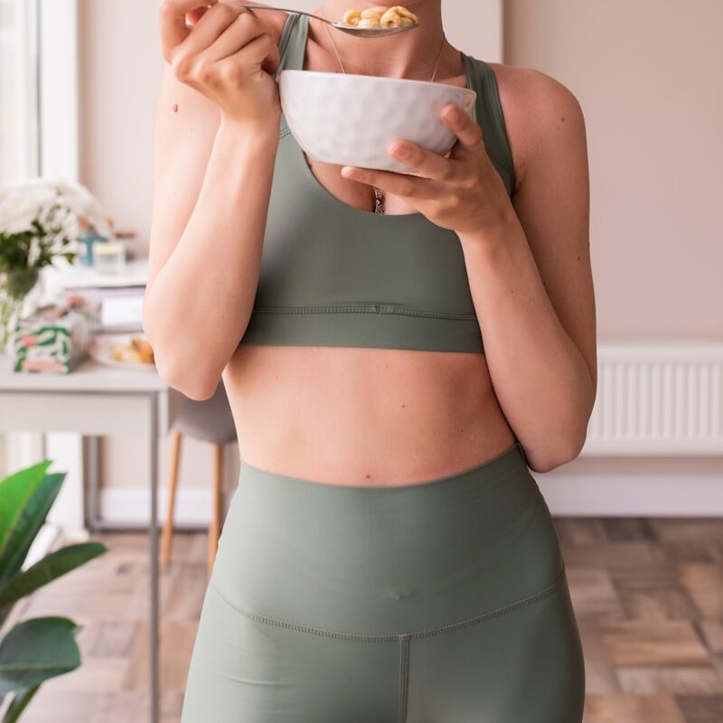 Close-up of a woman’s stomach area, symbolizing gut health and digestion — calm and relaxed posture. Nurturing the gut health tips naturally.