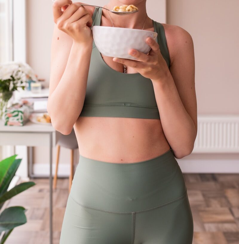 Close-up of a woman’s stomach area, symbolizing gut health and digestion — calm and relaxed posture. Nurturing the gut health tips naturally.