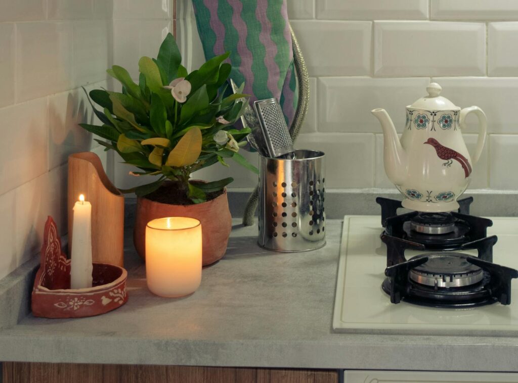 Peaceful cooking ritual with candlelight in a minimalist kitchen.