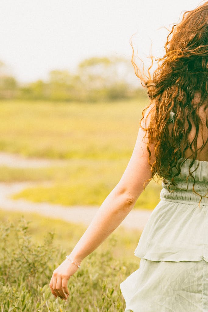 woman walking slowly outdoors for mindful movement as a soothing moves to melt stress fast